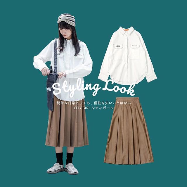 白色长袖衬衫 深卡其颜色的伞裙